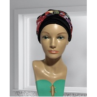 BEAUTIFUL SOFT FITTED TURBAN WITH TWISTED BAND IN RED/CORAL PRINT